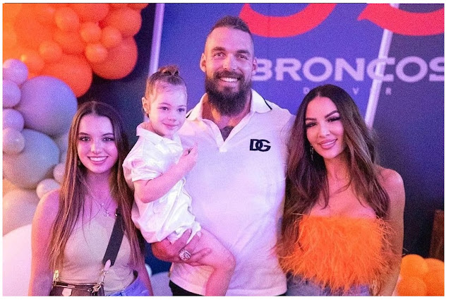 Derek Wolfe with wife and two Daughters